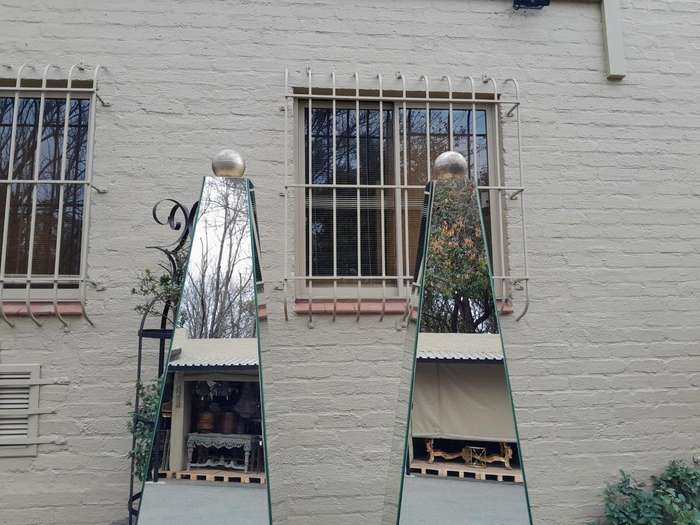 A Pair of Designer Mirror and Antique Gold Coloured Iron Ball and Detail Obelisks, Custom-made fo...