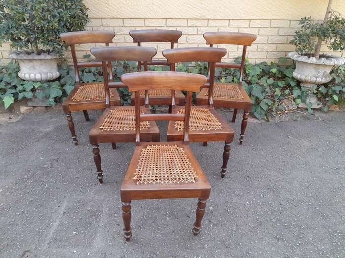 An Antique Set Of Six Cape Stinkwood Regency Chairs With Rattan Seats