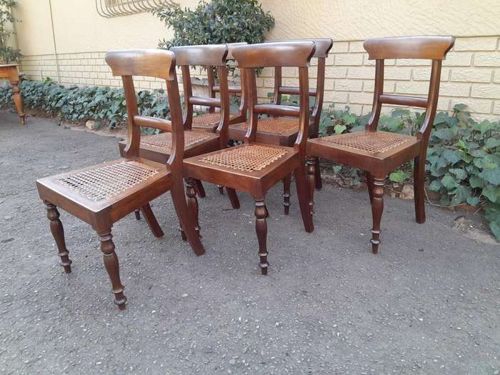 An Antique Set Of Six Cape Stinkwood Regency Chairs With Rattan Seats