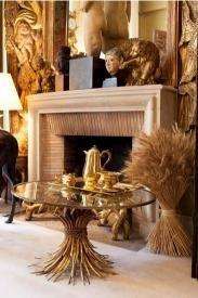 A 20th Century Rare Sculptured Iron Table Base in an Antique Gold Finish with Bevelled Glass Top ...