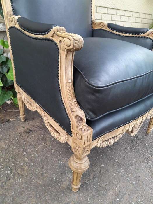 A 20TH Century Pair of French Louis XVI-style Walnut Fauteuils / Armchairs Upholstered in Leather...