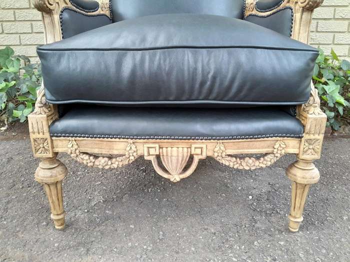 A 20TH Century Pair of French Louis XVI-style Walnut Fauteuils / Armchairs Upholstered in Leather...
