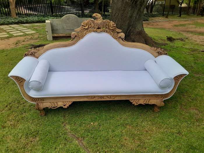 A 20th Century Ornately  Carved Eagle Settee In A Bleached Contemporary Finish Upholstered In A ...