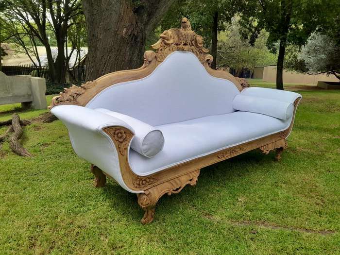 A 20th Century Ornately  Carved Eagle Settee In A Bleached Contemporary Finish Upholstered In A ...
