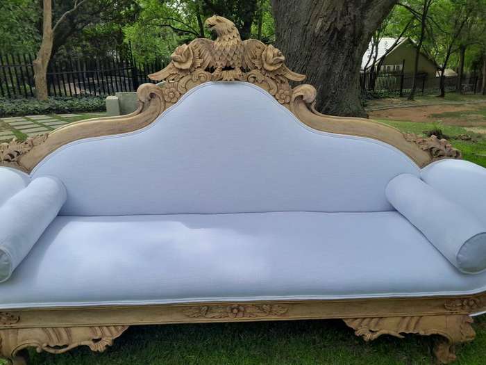 A 20th Century Ornately  Carved Eagle Settee In A Bleached Contemporary Finish Upholstered In A ...