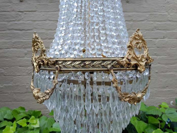 A 20th Century Empire French Style Brass And Crystal Chandelier