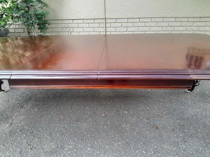 An Antique Victorian Mahogany Dining Table on Porcelain Castors with Three x Leaves and Crank Han...
