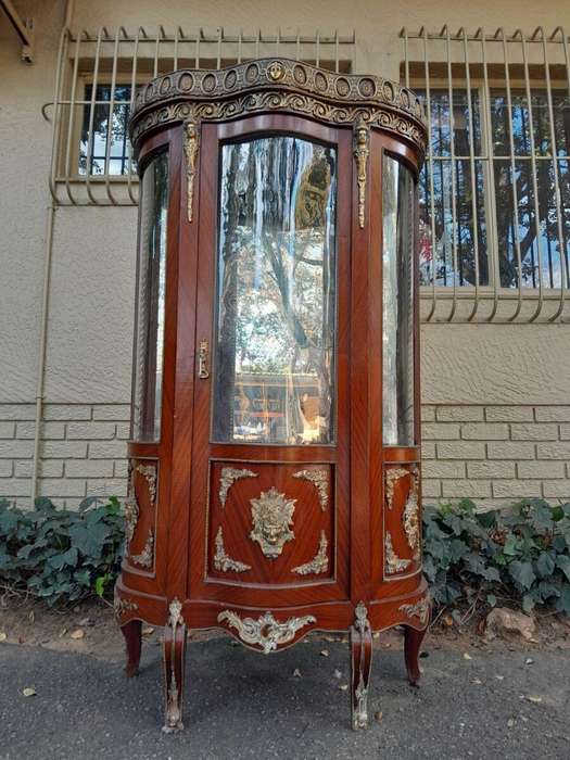 An Antique 20th Century French Ornate Style Mahogany Vitrine with Metal Mounts