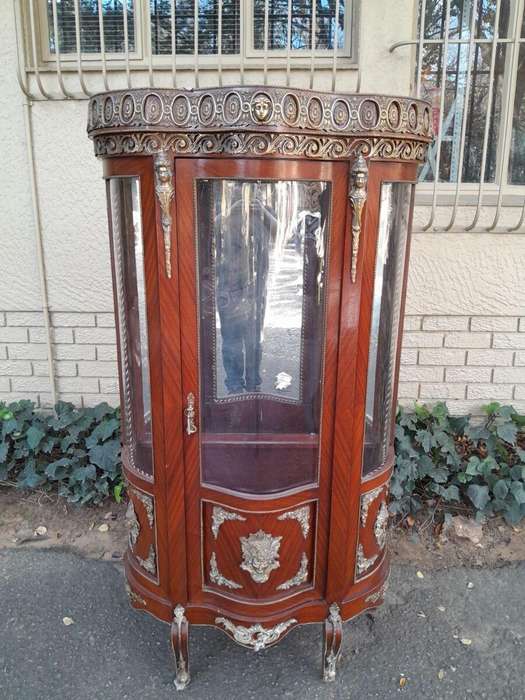 An Antique 20th Century French Ornate Style Mahogany Vitrine with Metal Mounts
