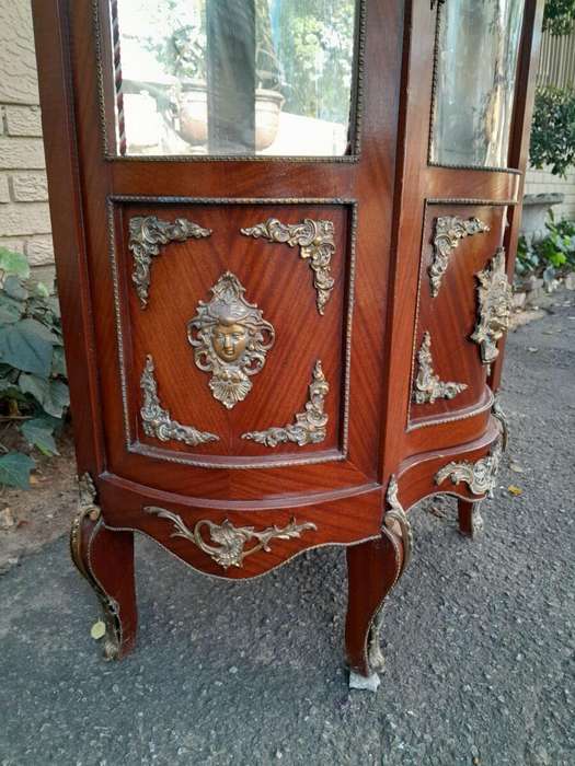 An Antique 20th Century French Ornate Style Mahogany Vitrine with Metal Mounts