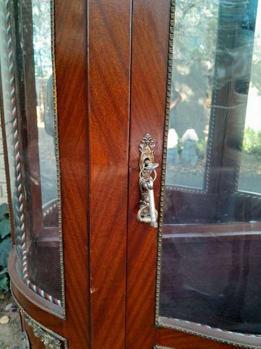 An Antique 20th Century French Ornate Style Mahogany Vitrine with Metal Mounts