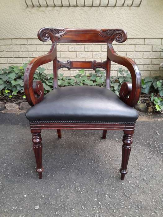 A 20th Century Set of Ten (10) William IV Style Mahogany Dining Chairs Consisting a Pair of Carve...