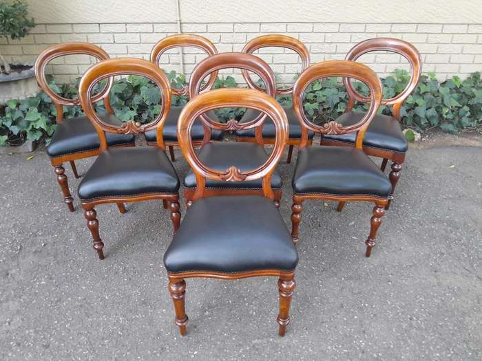 A 20th Century Set of Eight Victorian Style Mahogany Dining Chairs Upholstered in Leather