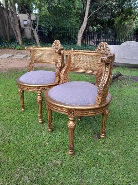 A Pair of French Louis XVI Style Carved and Rattan Chairs