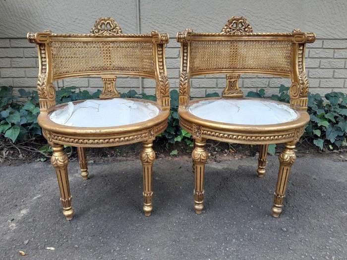 A Pair of French Louis XVI Style Carved and Rattan Chairs