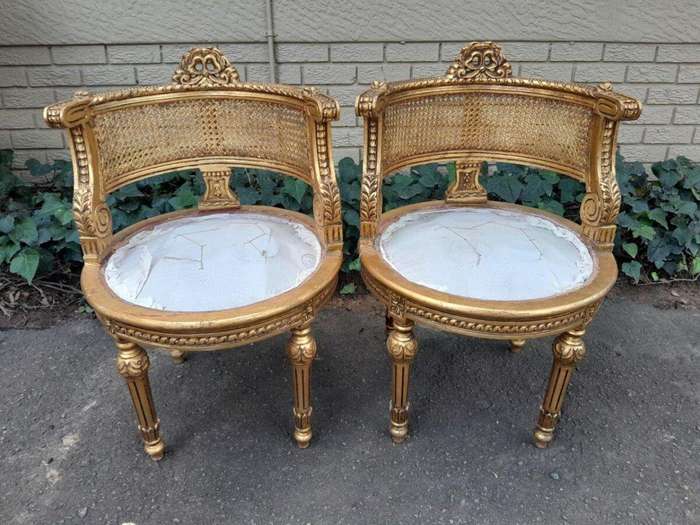 A Pair of French Louis XVI Style Carved and Rattan Chairs
