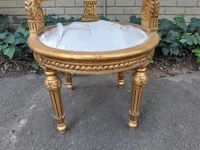 A Pair of French Louis XVI Style Carved and Rattan Chairs