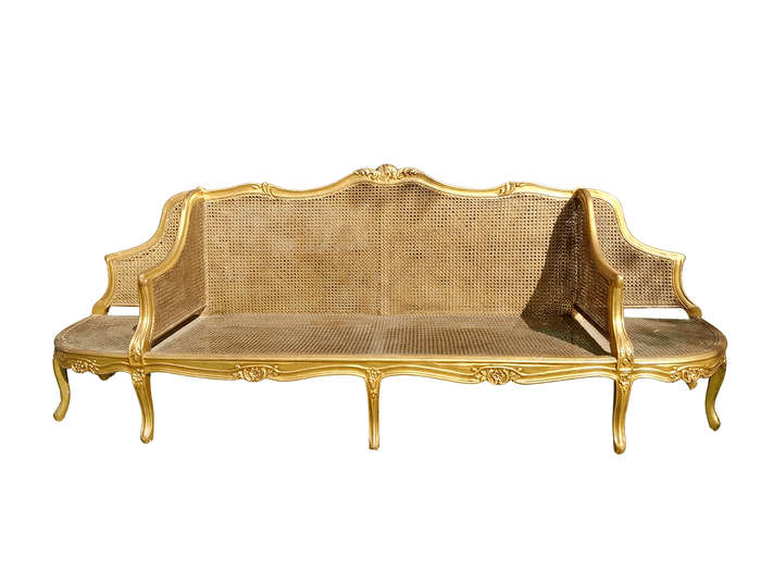 A 20th Century French Style Carved and Gilded Conversation Settee in Rattan