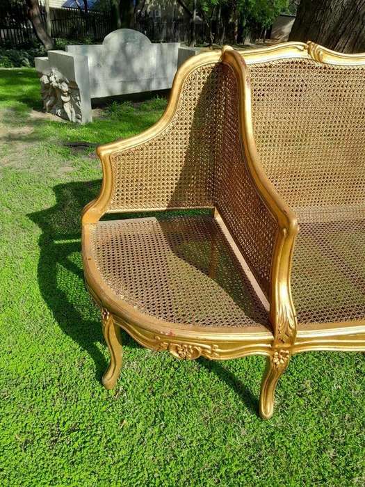 A 20th Century French Style Carved and Gilded Conversation Settee in Rattan