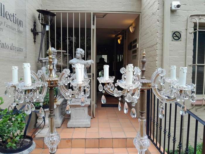 A 20th Century Pair of Crystal and Brass Floor Standing Chandeliers ND