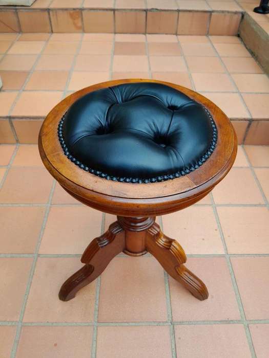 An Antique Victorian Mahogany Piano Stool Upholstered in Black Leather