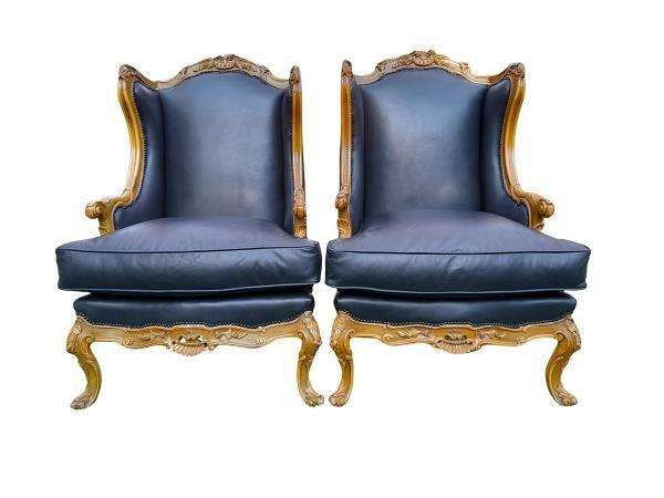A 20th Century Pair Of French Louis XVI Style Carved Wingback Armchairs