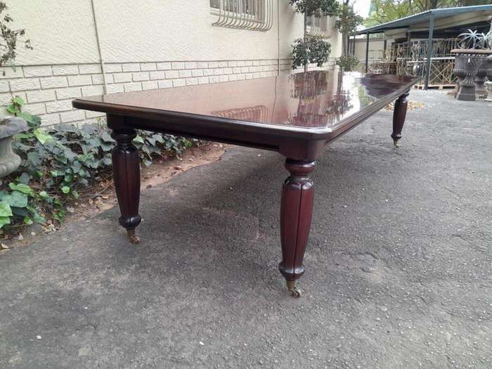 An Exceptional And Massive 20th Century Carved  Mahogany Dining Table On Large Brass Castors (14 ...