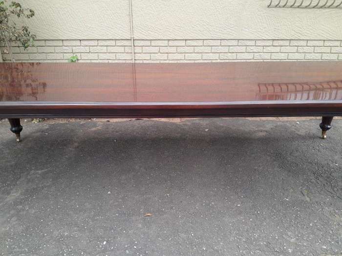 An Exceptional And Massive 20th Century Carved  Mahogany Dining Table On Large Brass Castors (14 ...
