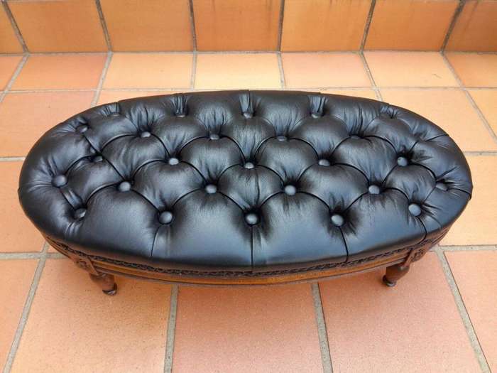 A 20th Century French Style Carved Beechwood Foot Stool Upholstered In Deep Buttoned Leather