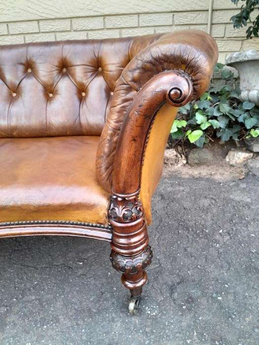 An Antique 19th Century Chesterfield Settee With Original Leather And Castors