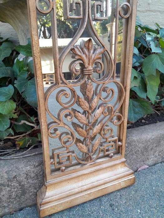 A 20th Century Pair Of Decorative Metal Plaque Style Mirrors