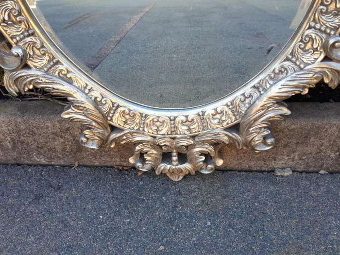 A French Style Ornately Carved And Bevelled Mirror In A Contemporary Silver Hand-Gilded Finish
