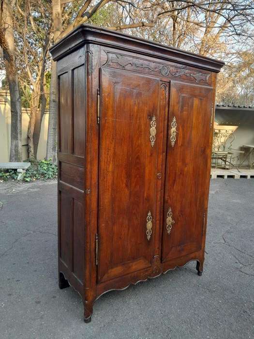 An Antique Early 19th Century French Walnut Armoire With Brass Plates