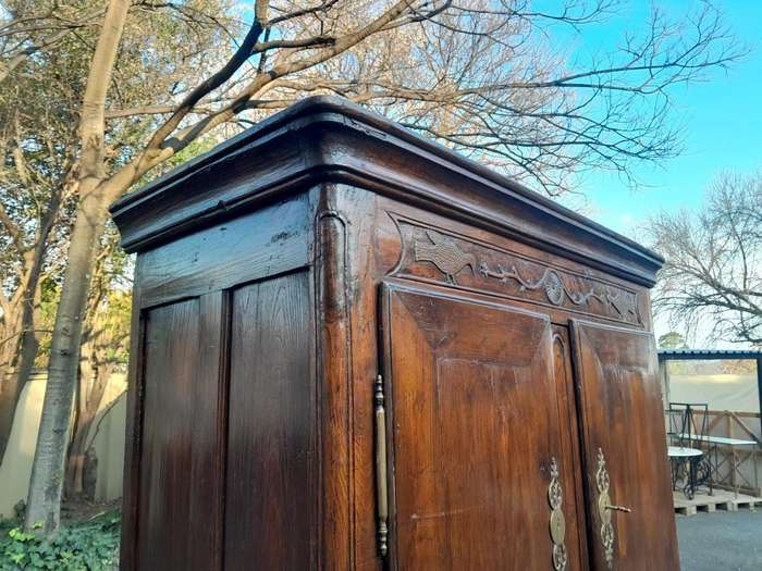 An Antique Early 19th Century French Walnut Armoire With Brass Plates