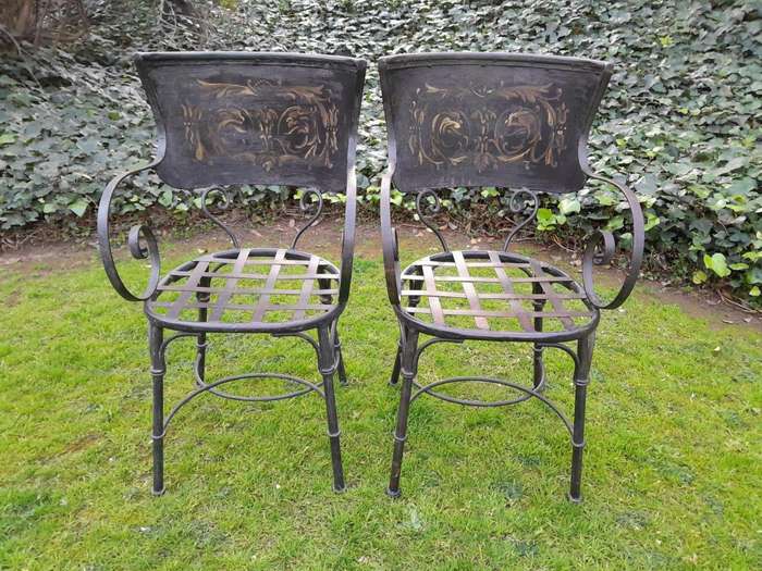 A Rare Pair Of Wrought Iron And Embossed Highly Decorative Chairs With Lattice Seats