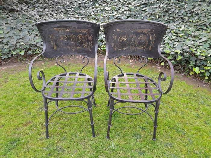 A Rare Pair Of Wrought Iron And Embossed Highly Decorative Chairs With Lattice Seats