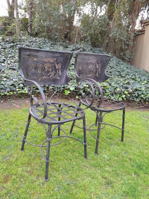 A Rare Pair Of Wrought Iron And Embossed Highly Decorative Chairs With Lattice Seats