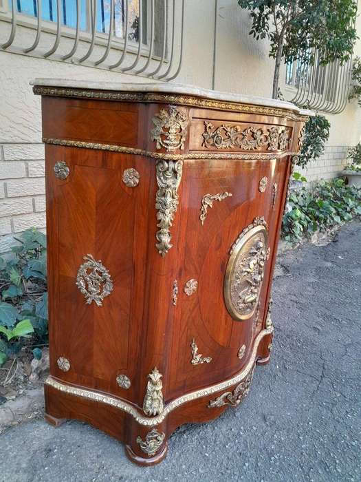 A 20th Century French Louis XV Style Mahogany Credenza With Brass Hardware And Stone Top, Interna...