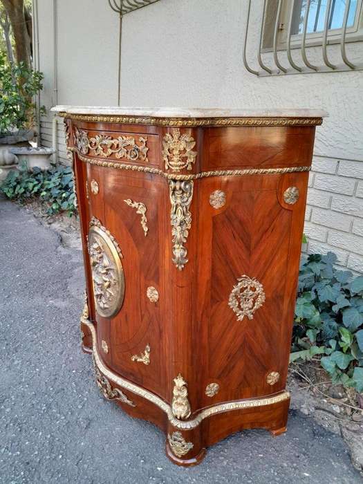 A 20th Century French Louis XV Style Mahogany Credenza With Brass Hardware And Stone Top, Interna...