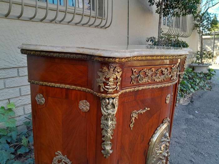A 20th Century French Louis XV Style Mahogany Credenza With Brass Hardware And Stone Top, Interna...