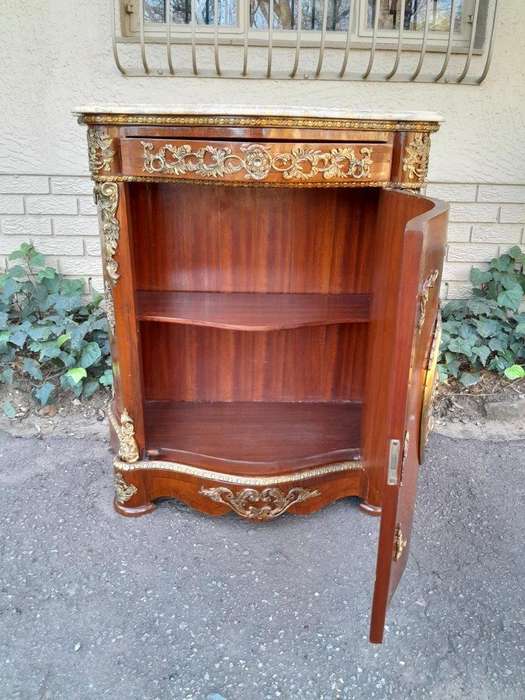 A 20th Century French Louis XV Style Mahogany Credenza With Brass Hardware And Stone Top, Interna...