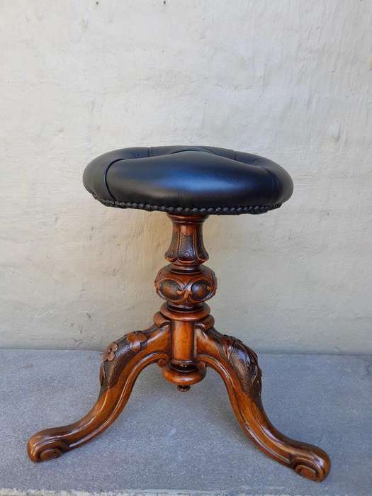 An Antique Circa 1870s Victorian Carved Walnut  Piano Stool Upholstered In Leather
