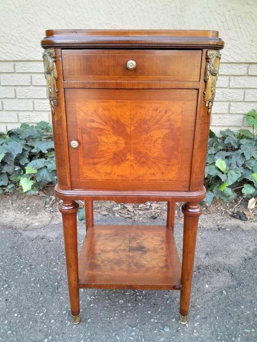 A 19th Century French Inlaid Wooden Bedside Pedestal With Brass Mounts, With Drawer