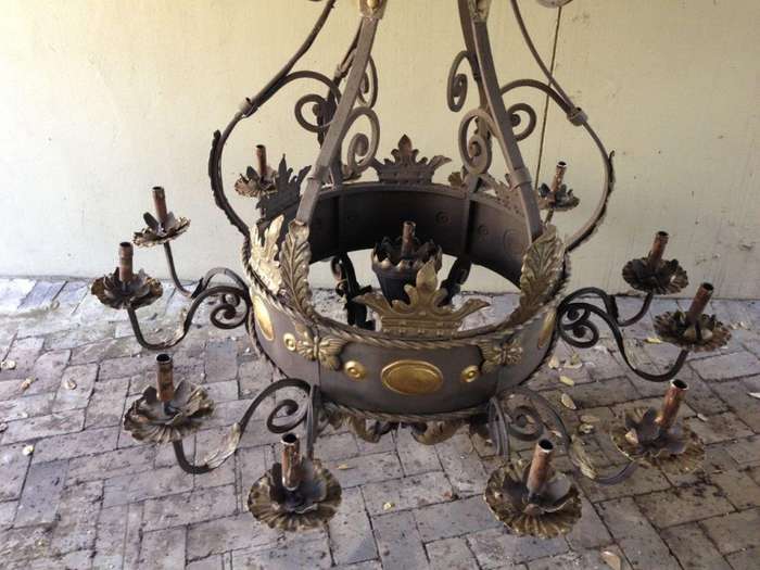 A Large Wrought Iron and Hand-Painted Imported Chandelier with Crown Detail