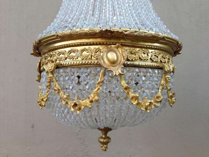 A 20th Century Empire Style Brass and Crystal Chandelier