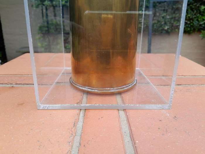 A 20TH Century Brass Cannon Shell In A Custom-Made Display Perspex Box