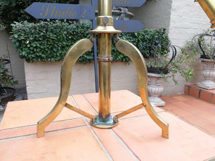 An Antique Brass Floor Standing Telescope On Tripod With Lens Cover