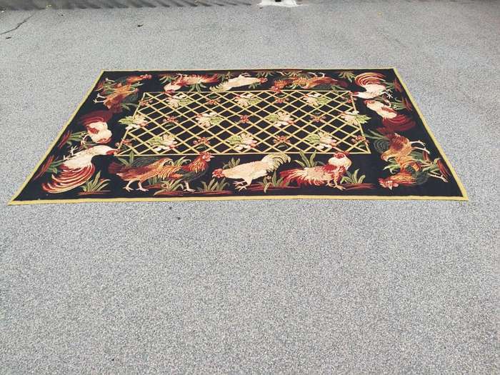 A Needlepoint Woven Carpet