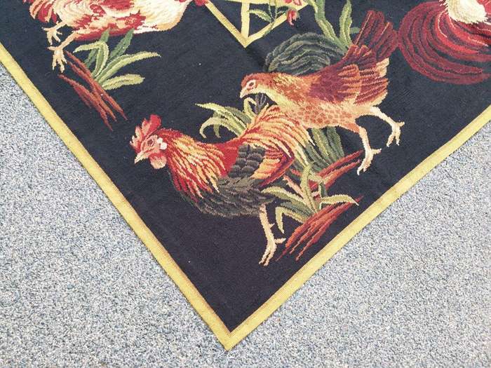A Needlepoint Woven Carpet