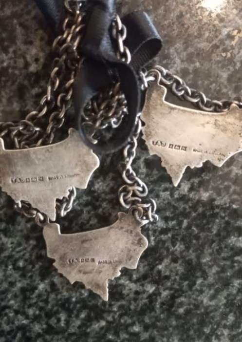A Set of Three Birmingham Silver Decanter Labels Silver weight: 34 grams